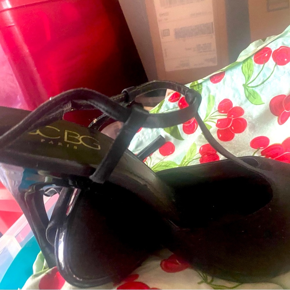 Black satin sandals with t-strap and high spiked heel. 10